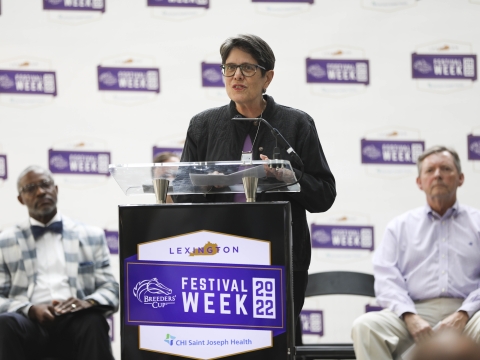 Mayor Linda Gorton speaking at a lectern during a Breeders' Cup press conference held earlier in the year